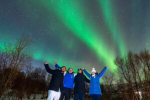 From Tromsø: Aurora Minibus Chase with Portrait and Hot Meal - Inside the warm minibus: how the sky-cam changes the waiting game
