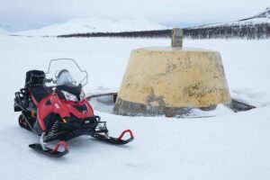 Snowmobile Adventure to 3-Country Border - Snowmobile basics: safety briefing, driver rules, and the deductible
